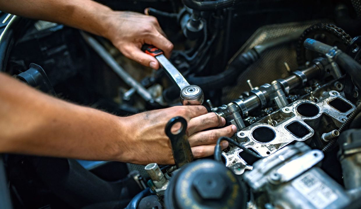 Mechanic using a ratchet wrench