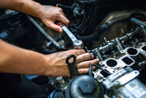 Mechanic using a ratchet wrench