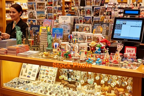 Gift Shop Counter with Souvenirs and Clerk.