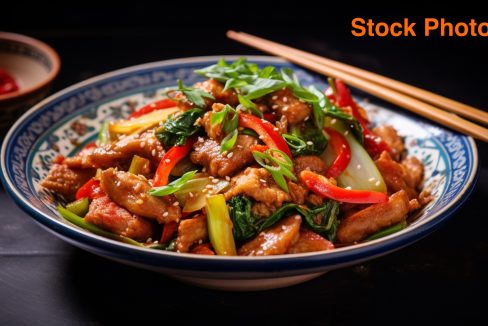 vecteezy_stir-fried-pork-and-vegetables-on-a-plate-with-chopsticks_32947206